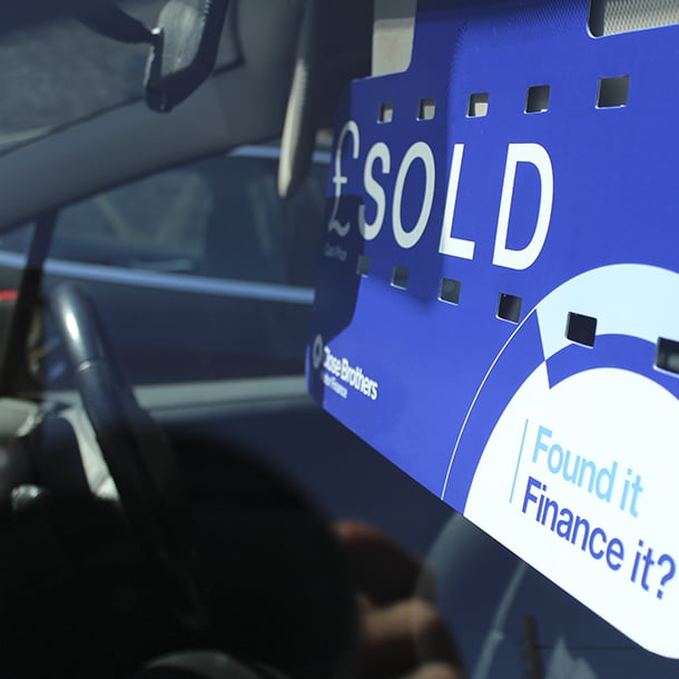Close Brothers Motor Finance sold sign in car